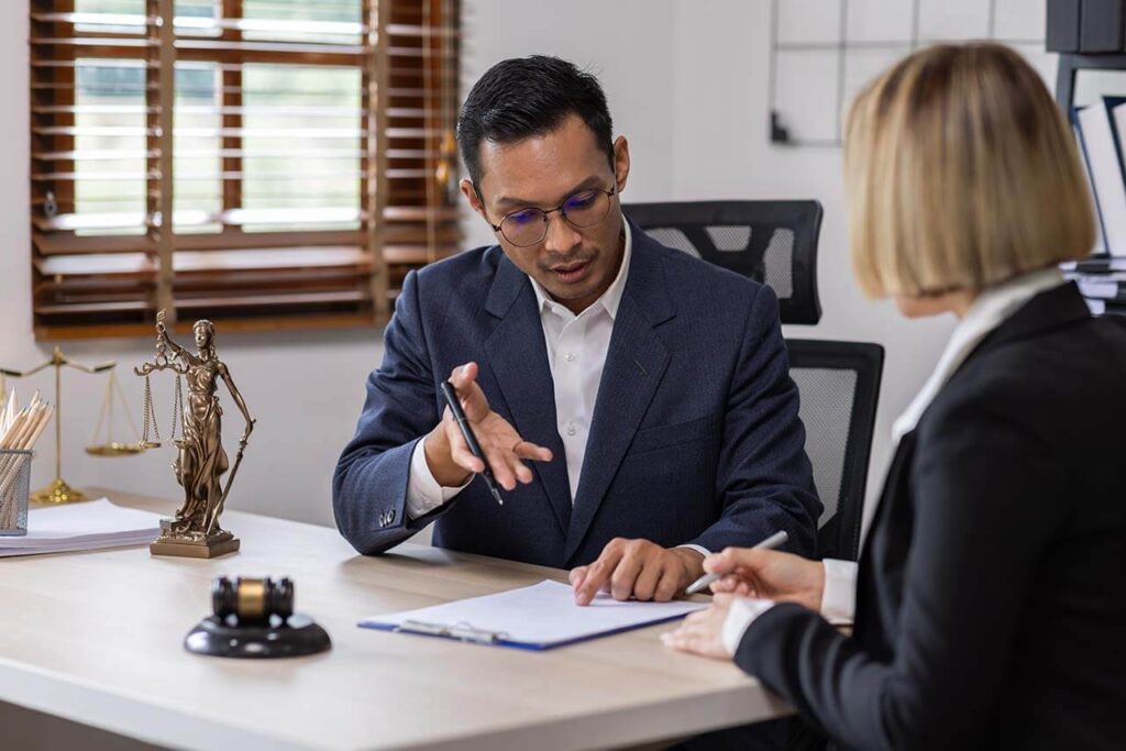 Lawyer actively explaining the details of Power of Attorney to a client in Victoria.