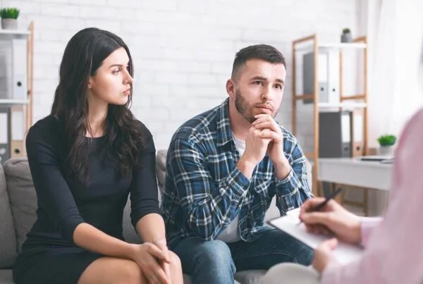 Couple receiving legal advice from a solicitor in Dandenong during a family law consultation.