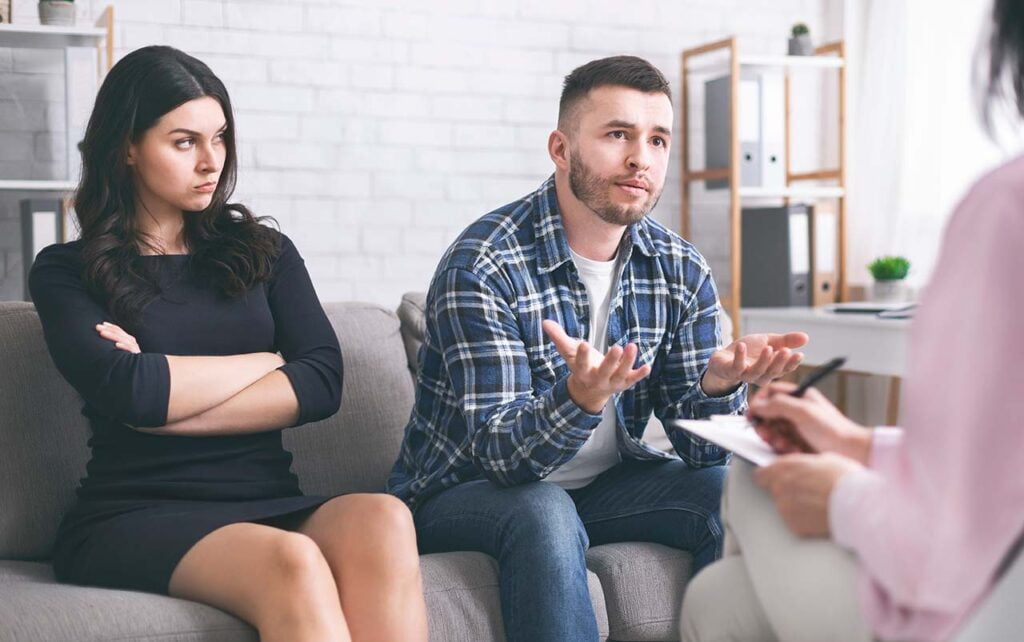 Couple discussing family law issues with a solicitor in Dandenong.