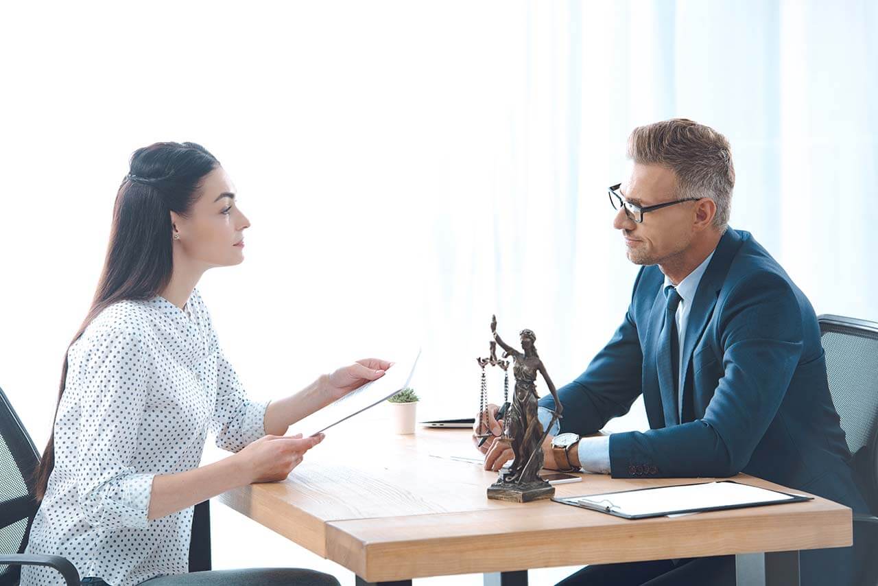 Family lawyer discussing spousal and child support with a client.